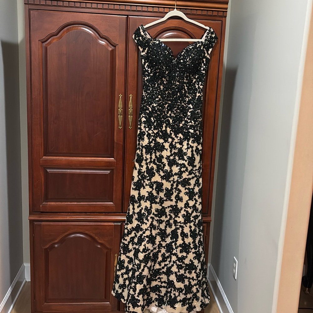 Beautiful Tony Bowls pageant gown. Size 2. Off shoulder. Black and nude.